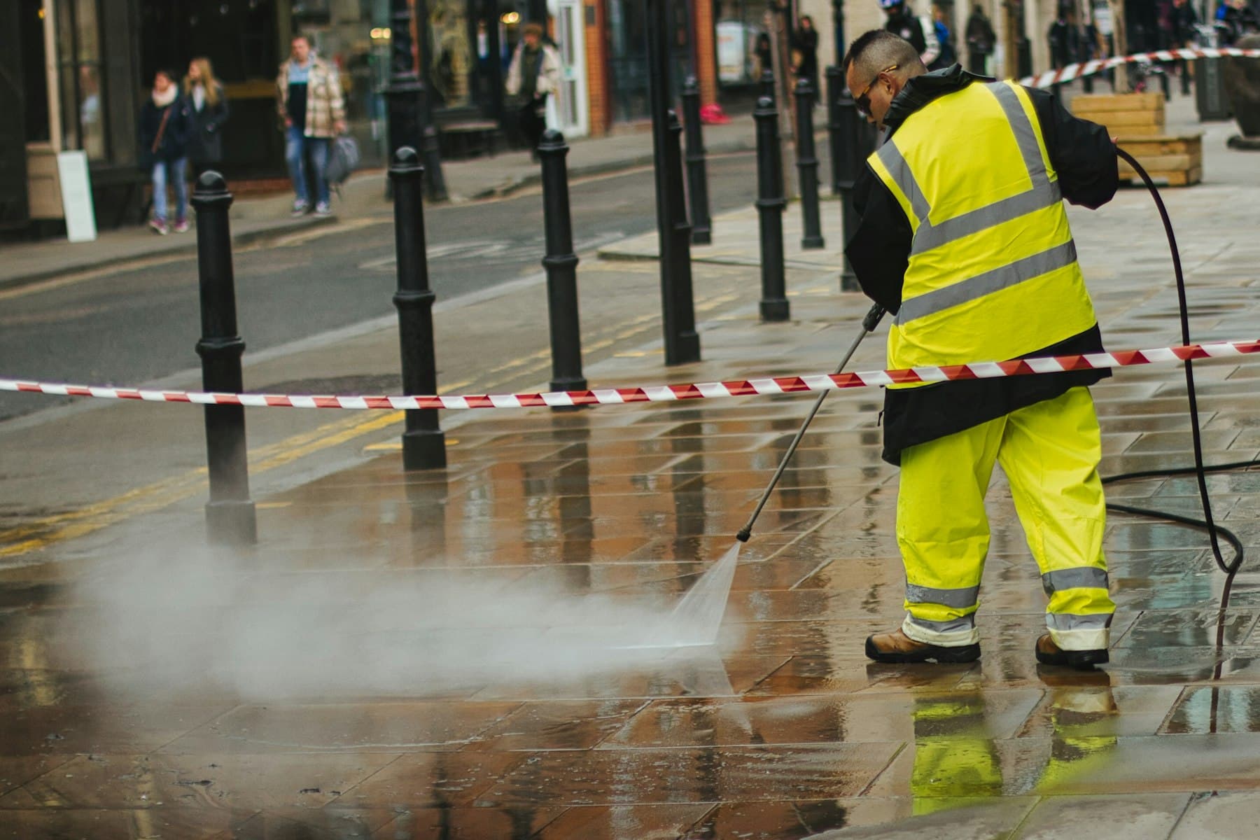 Operator pressure washing paving