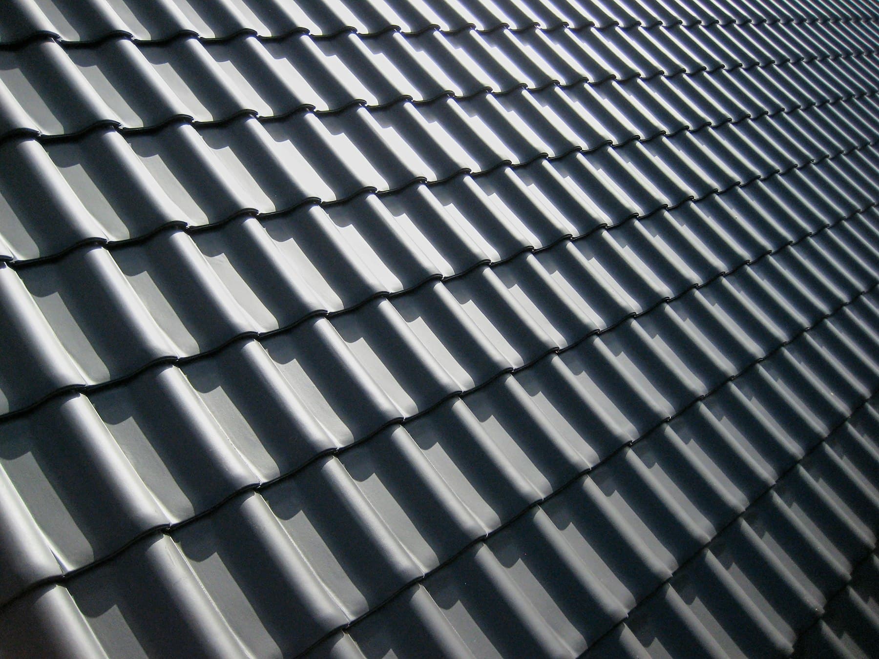 Tiled roof ridge freshly painted, seen from above